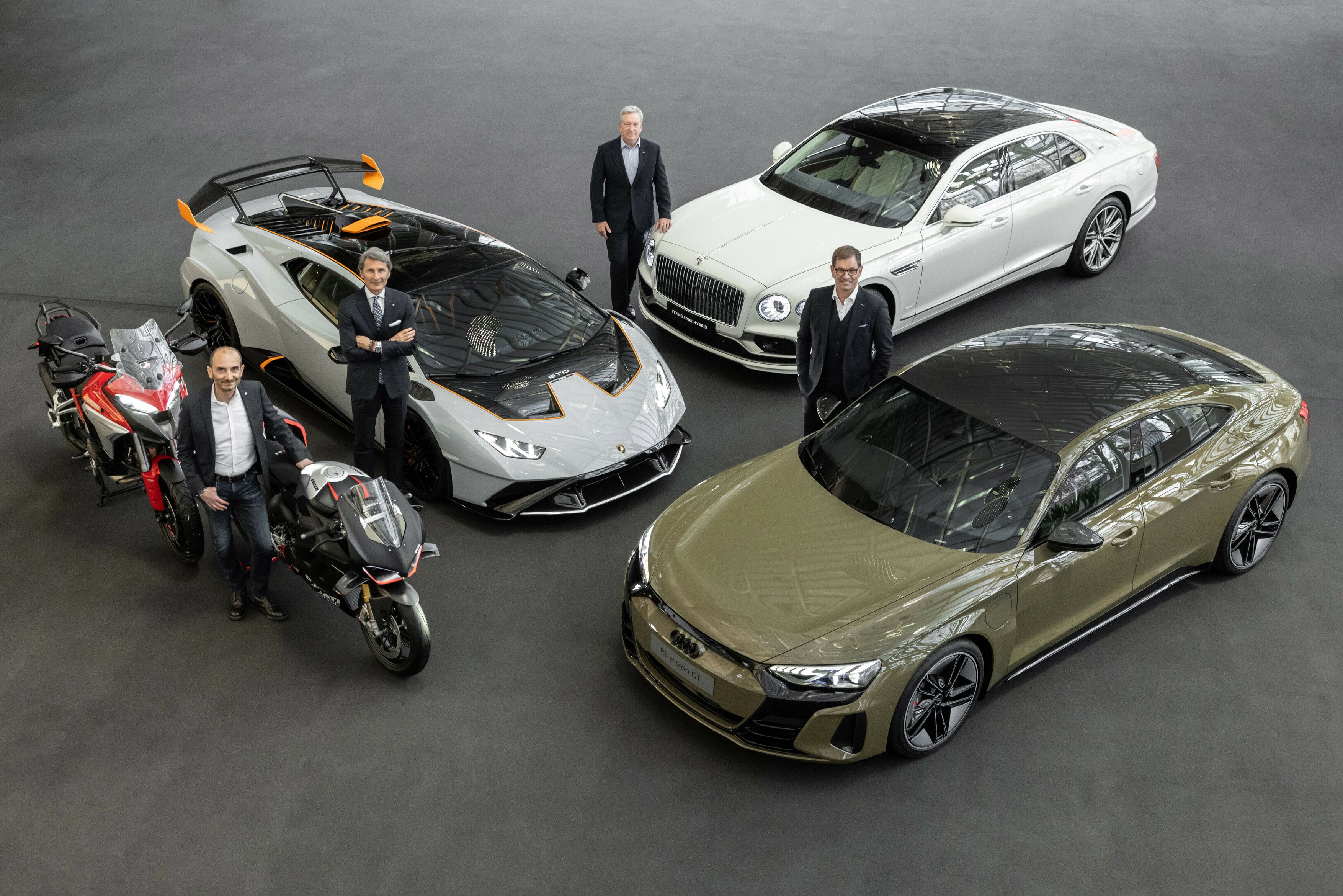 Picture starting left Claudio Domenicali (CEO Ducati Motor Holding S.p.A.), Stephan Winkelmann (CEO Automobili Lamborghini S.p.A.Huracan STO), Adrian Hallmark (CEO Bentley Motors Ltd.), Markus Duesmann (CEO AUDI AG).jpg